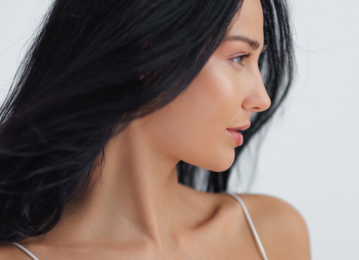Profile of a woman with long black hair.