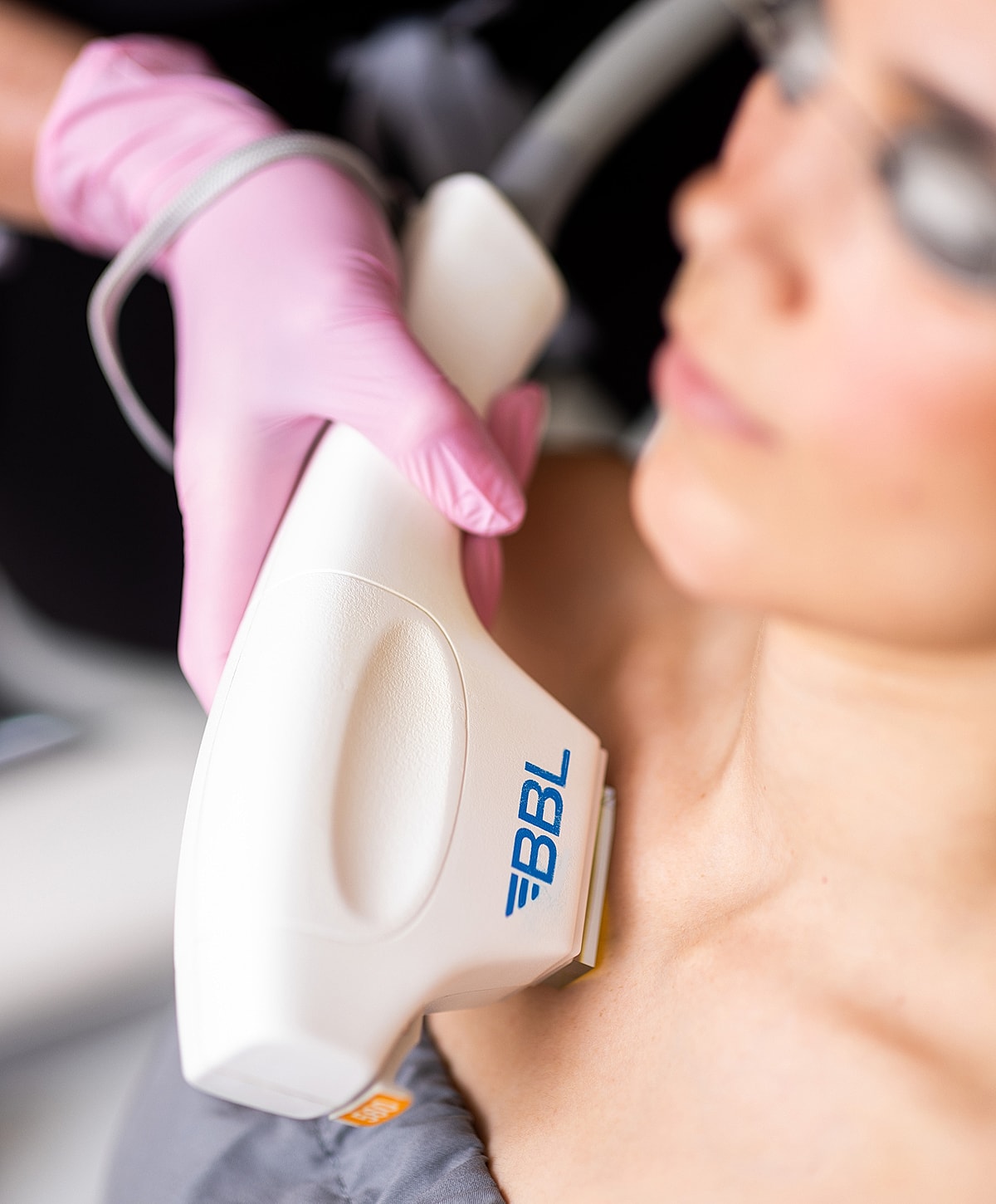 BBL device being used on a person's skin.