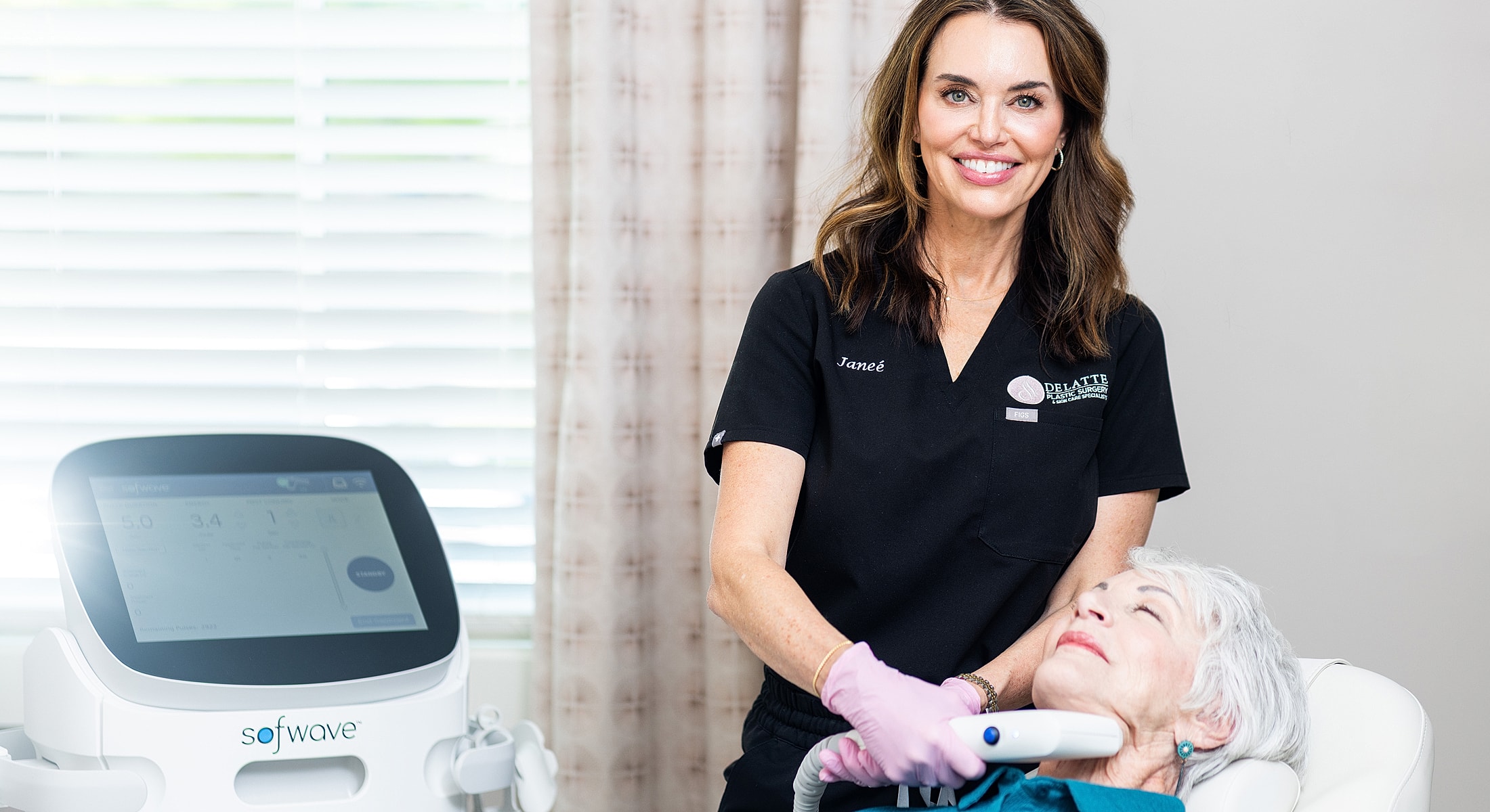 Facial treatment session with medical professional and patient.